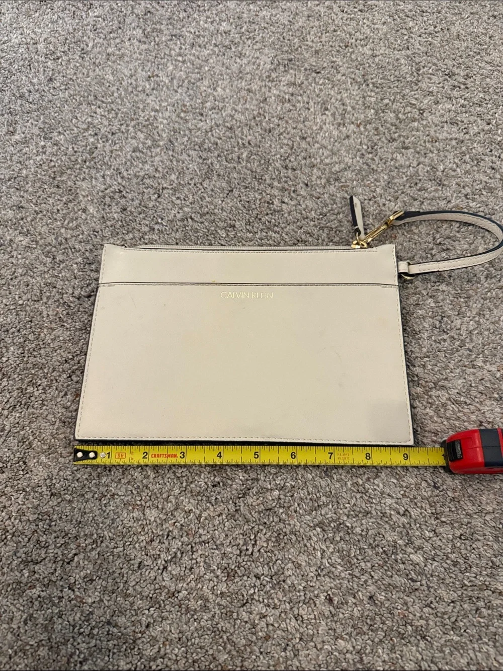 Calvin Klein Ivory Wristlet with Gold Hardware